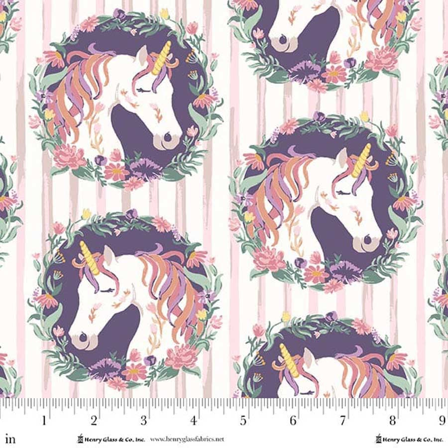 Fabric pattern with unicorns and floral wreaths on a pink and white striped background.